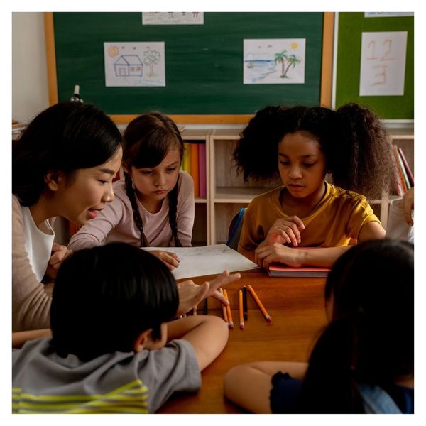 elementary students working at table