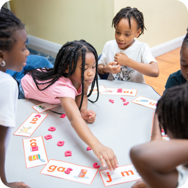Kids playing card game for spelling