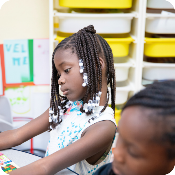 Two girls doing school work