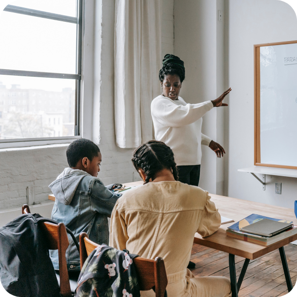 Teacher in a classroom with two students