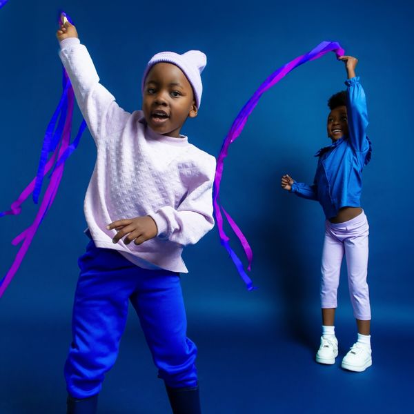 Two kids dancing with ribbons