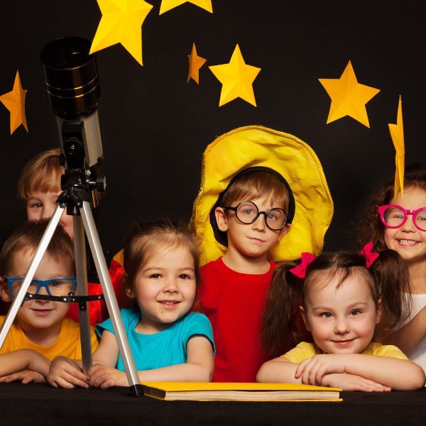 Kids in a play posing for a picture