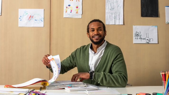 Teacher sitting at desk