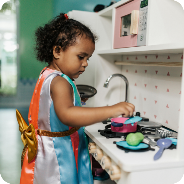 preschool child playing kitchen
