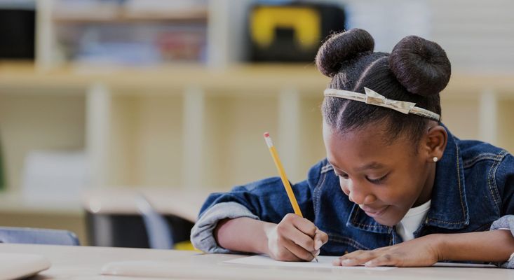 a little girl working on an assignment