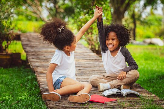 Happy little boy and girl in the park..jpg
