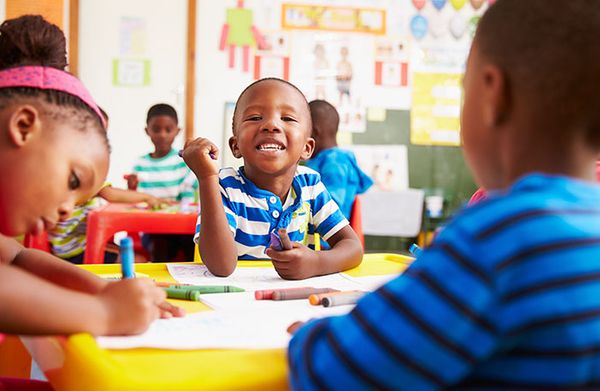 kids coloring with crayons