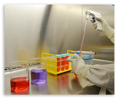 Laboratory worker using a pipette