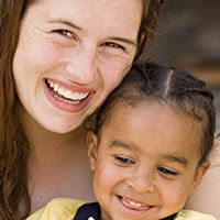 woman laughing with little girl