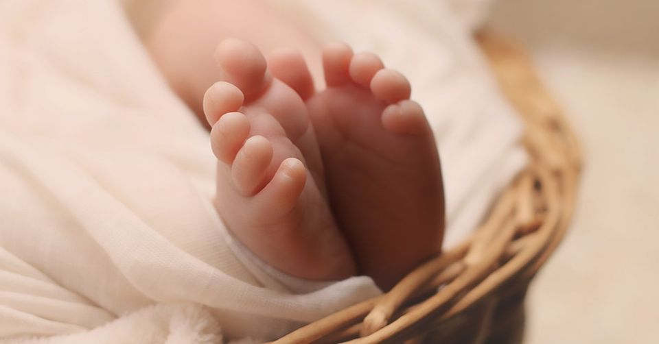 closeup image of newborn baby's feet