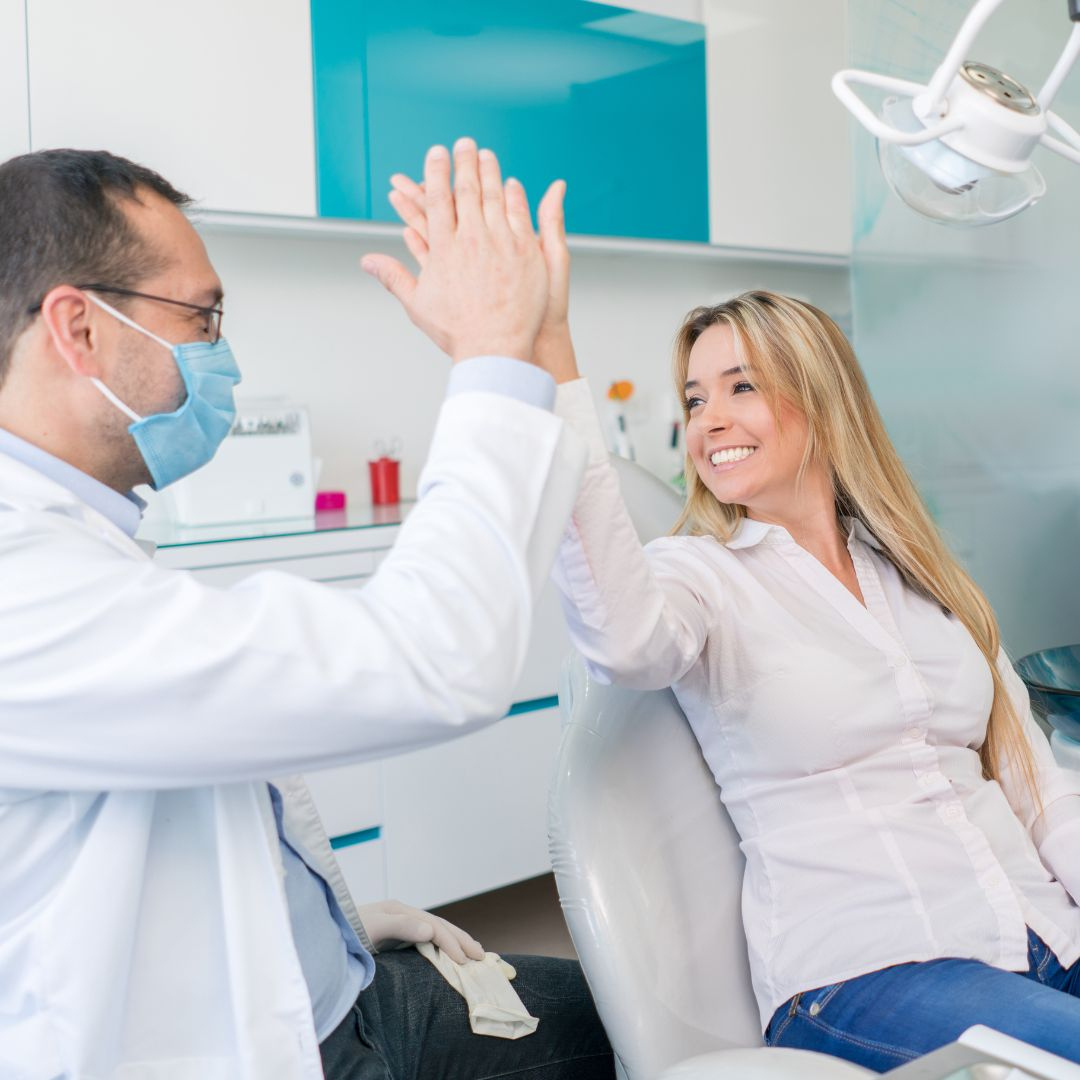Patient high-fiving doctor