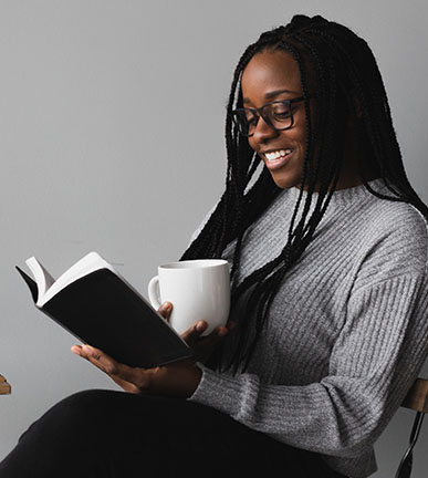 image of a happy woman reading