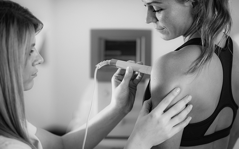 Woman getting physical therapy on her shoulder