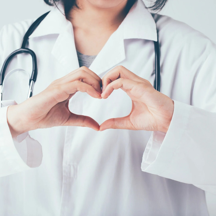 doctor making heart shape with hands