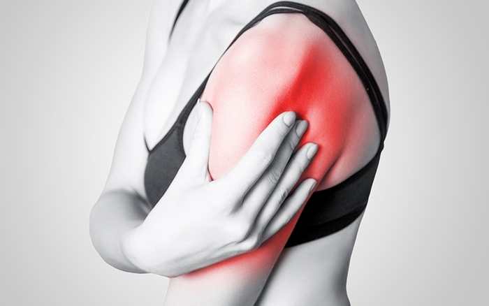 Woman experiencing shoulder pain