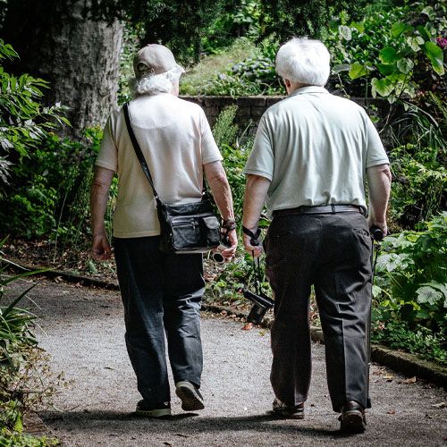 senior-couple-walking-on-path.jpg