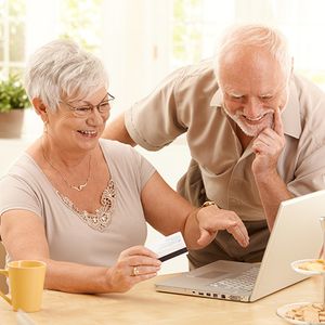elderly couple comparing insurance plans