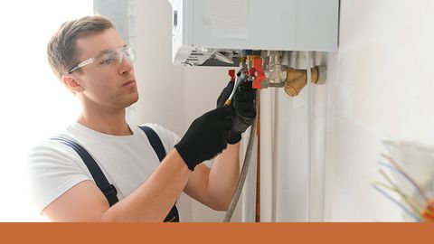 plumber repairing tankless water heater