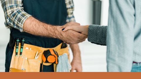 plumber shaking hands with client