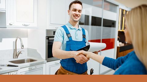 plumber shaking hands with client