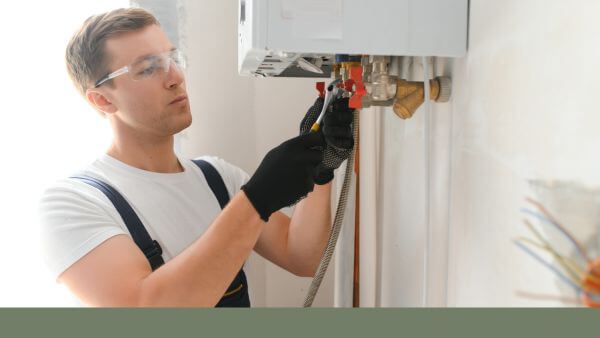 plumber working on hot water heater