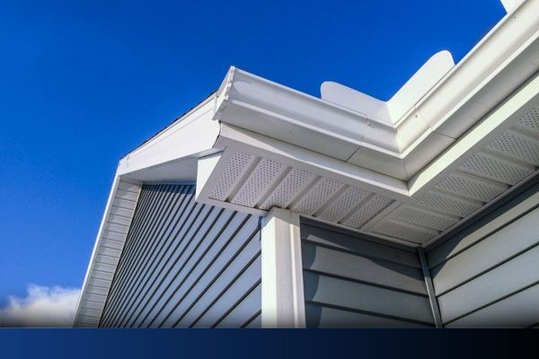 Newly installed grey-blue siding.