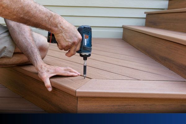 Worker Installing Composite Wood Decking
