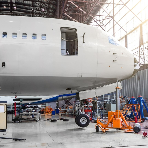 airplane lifted in shop for landing gear maintenance