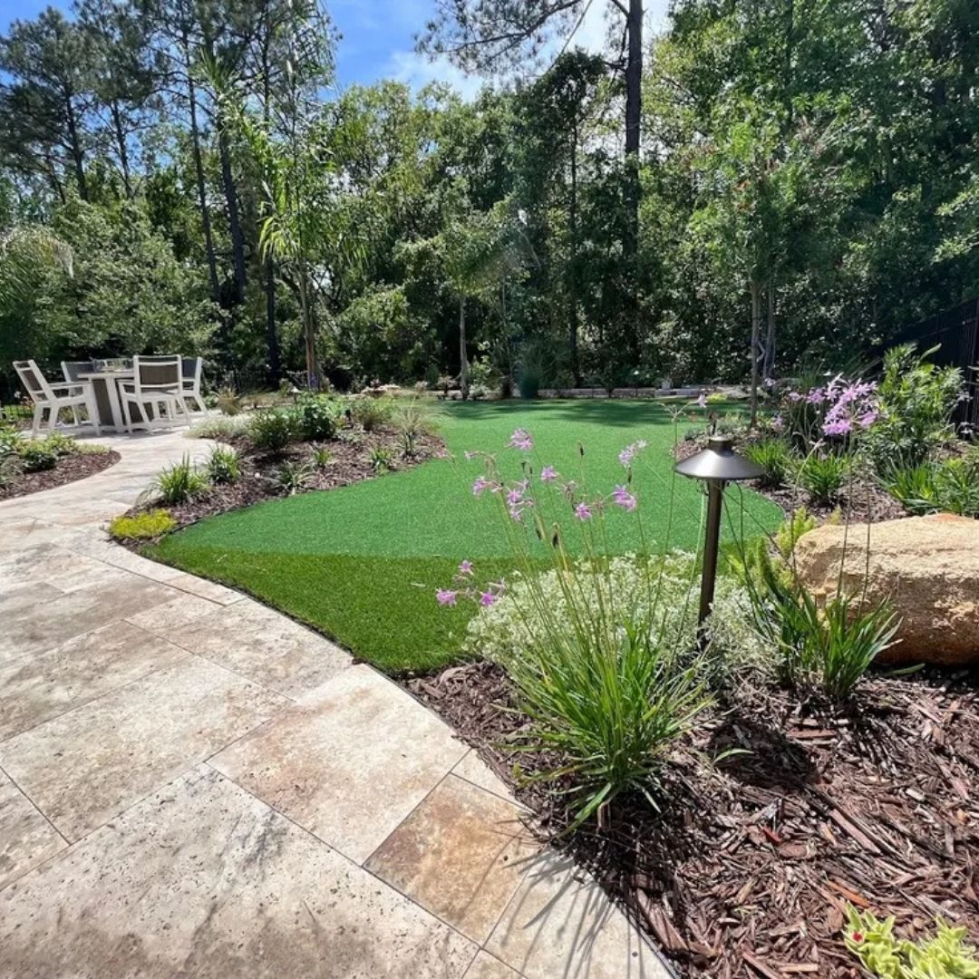 a section of backyard with astro turf