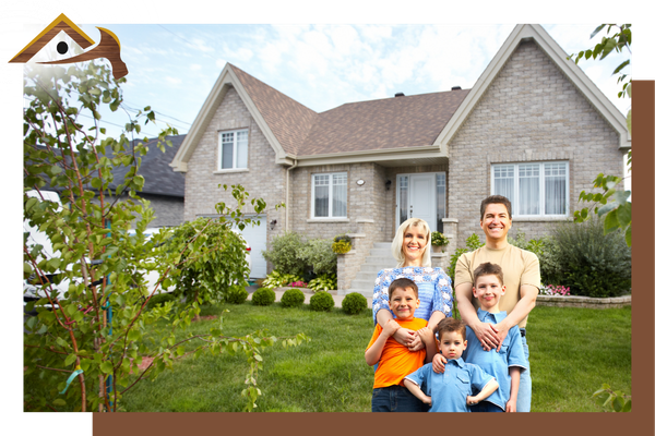 family standing in front of their new home