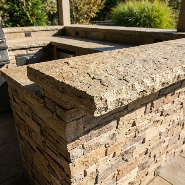 outdoor kitchen featuring a rough, chiseled edge natural stone countertop