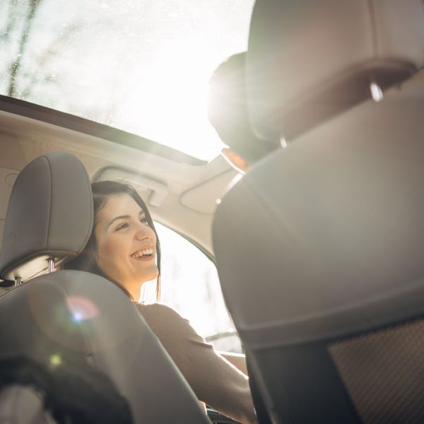 2 people listening to music in car together