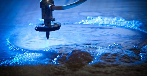 Waterjet cutting machine spraying water