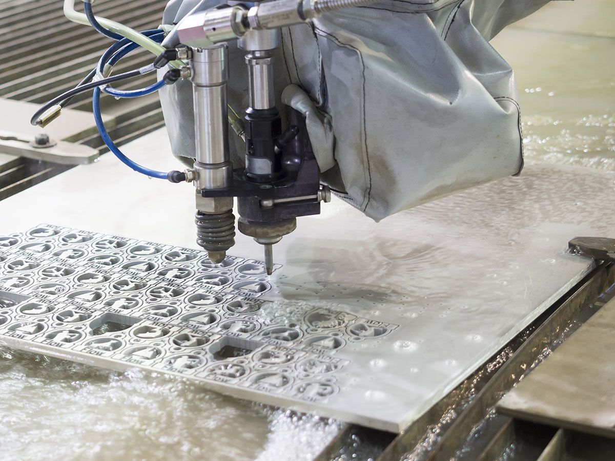 Waterjet cutter cutting a design