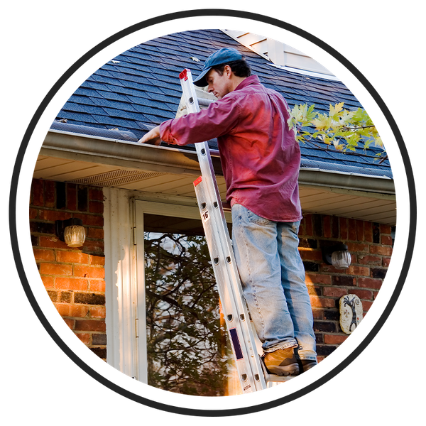 Image of a man cleaning gutters on a ladder.