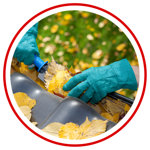 Image of a gutter cleaner clearing leaves from a gutter trough. 