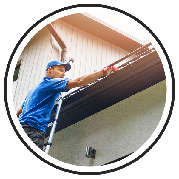  Image of a gutter contractor cleaning gutters.