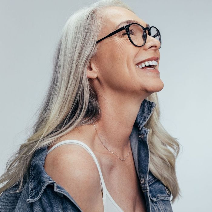 smiling older woman wearing glasses smiling older woman wearing glasses