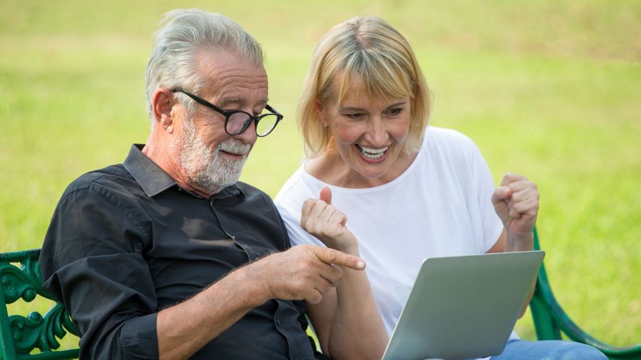older couple looking at laptop together
