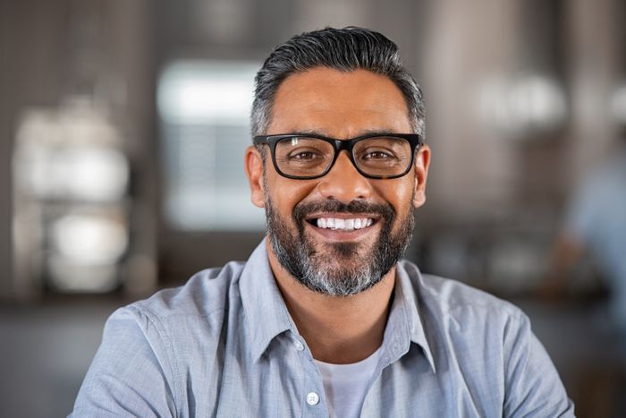 Man Smiling In Glasses