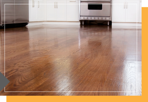 A kitchen with hardwood floors