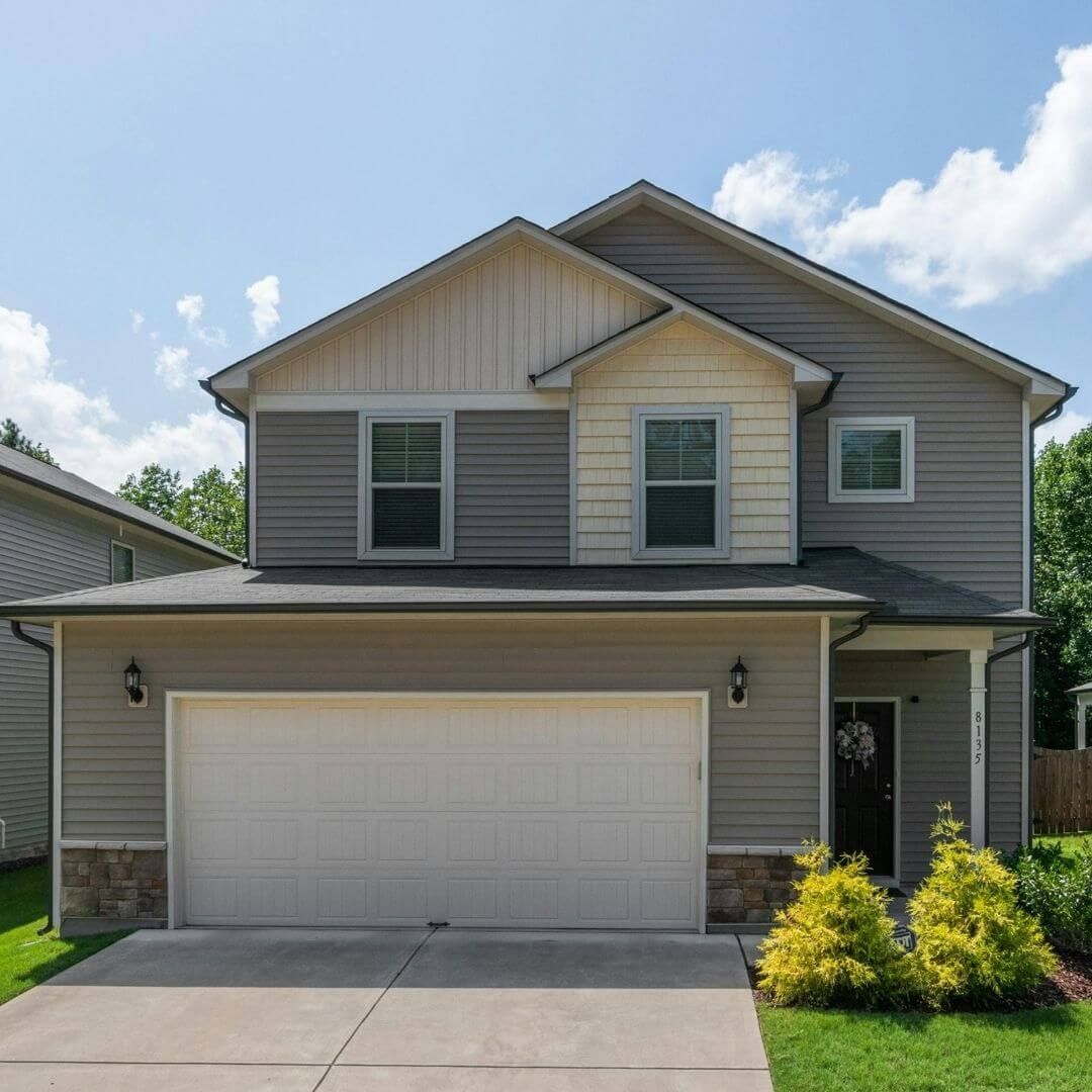 home with vinyl and shake siding
