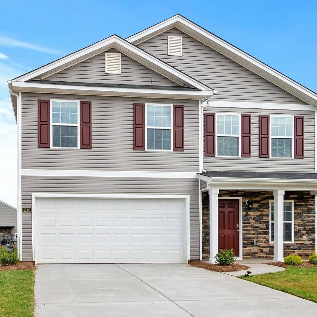 house with tan siding and white trim