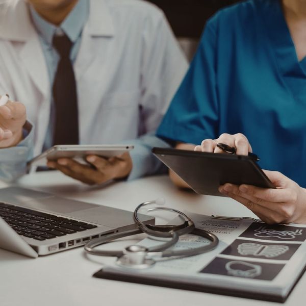 nurses and cotros on tablets and computers