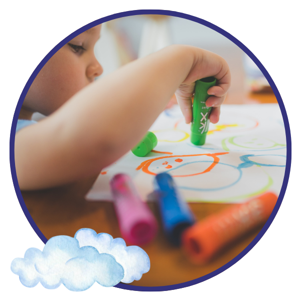 Preschool child drawing with markers