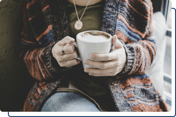 woman holding coffee cup