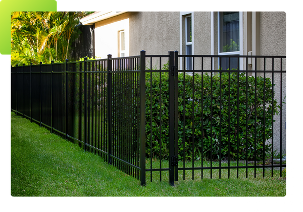 black aluminum fence wrapping around house