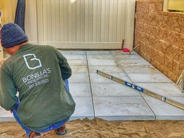 Landscaping contractor laying cement patio - Bonilla's Landscapes