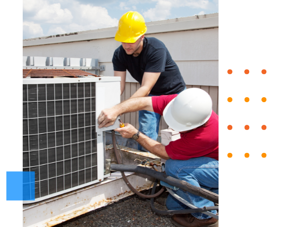 techs working on an AC unit