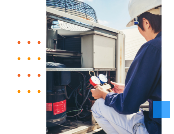 hvac technician working on ac unit